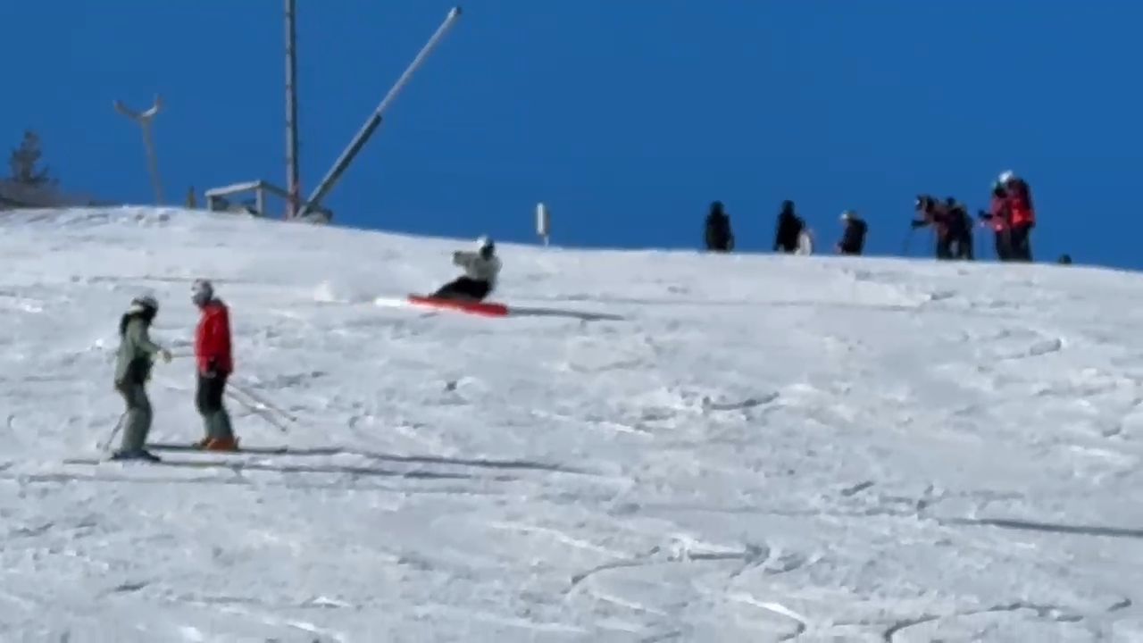 Skiers and snowboarders on a snow-covered slope